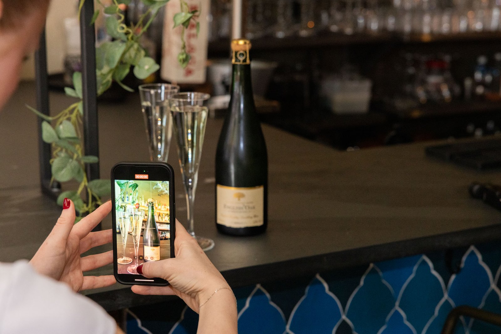 Social Media Manager taking content on iPhone